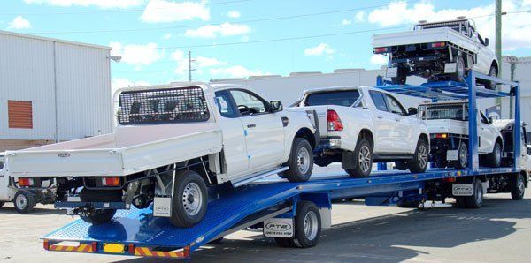 A White Truck Is Sitting on Top of A Blue Tow Truck — Welshpool, WA — PTE Group Pty Ltd