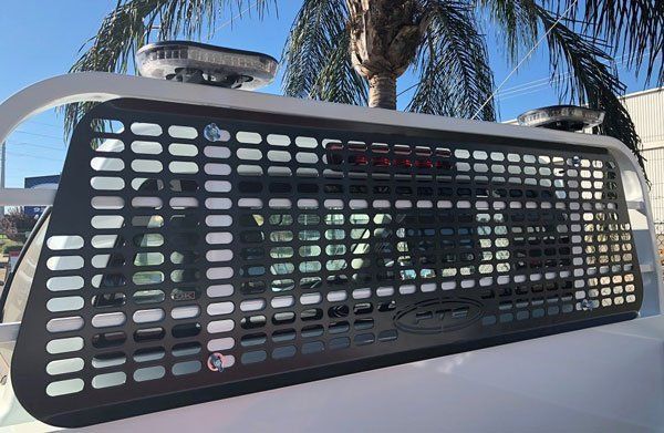 Truck with A Grille on The Back of It and A Palm Tree in The Background — Welshpool, WA — PTE Group Pty Ltd
