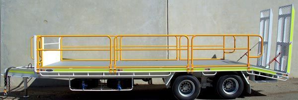 A Truck with A Trailer Attached to It Is Parked in Front of A Concrete Wall — Welshpool, WA — PTE Group Pty Ltd