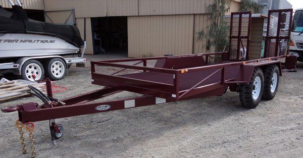 A Beautiful Red Trailer Is Parked in Front of A Building Next to A Boat — Welshpool, WA — PTE Group Pty Ltd