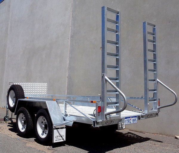 A Trailer with A Ladder Attached to The Back Is Parked in Front of A Building — Welshpool, WA — PTE Group Pty Ltd