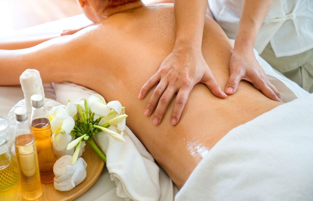 A Woman Is Getting A Massage At A Spa — Caves Coastal Physiotherapy in Caves Beach, NSW