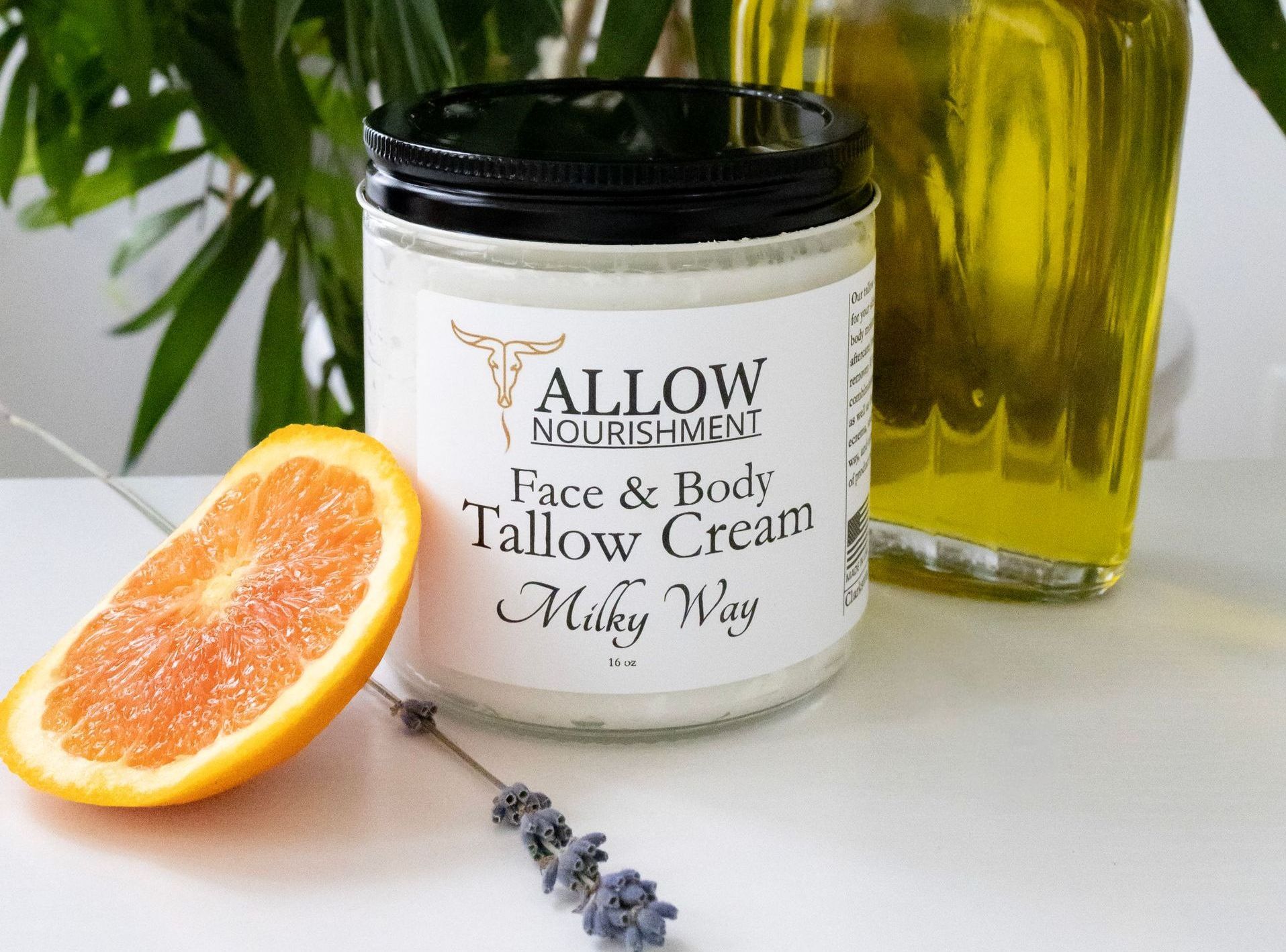 Allow Nourishment's Milky Way Tallow Face and Body Cream sitting on a table. 