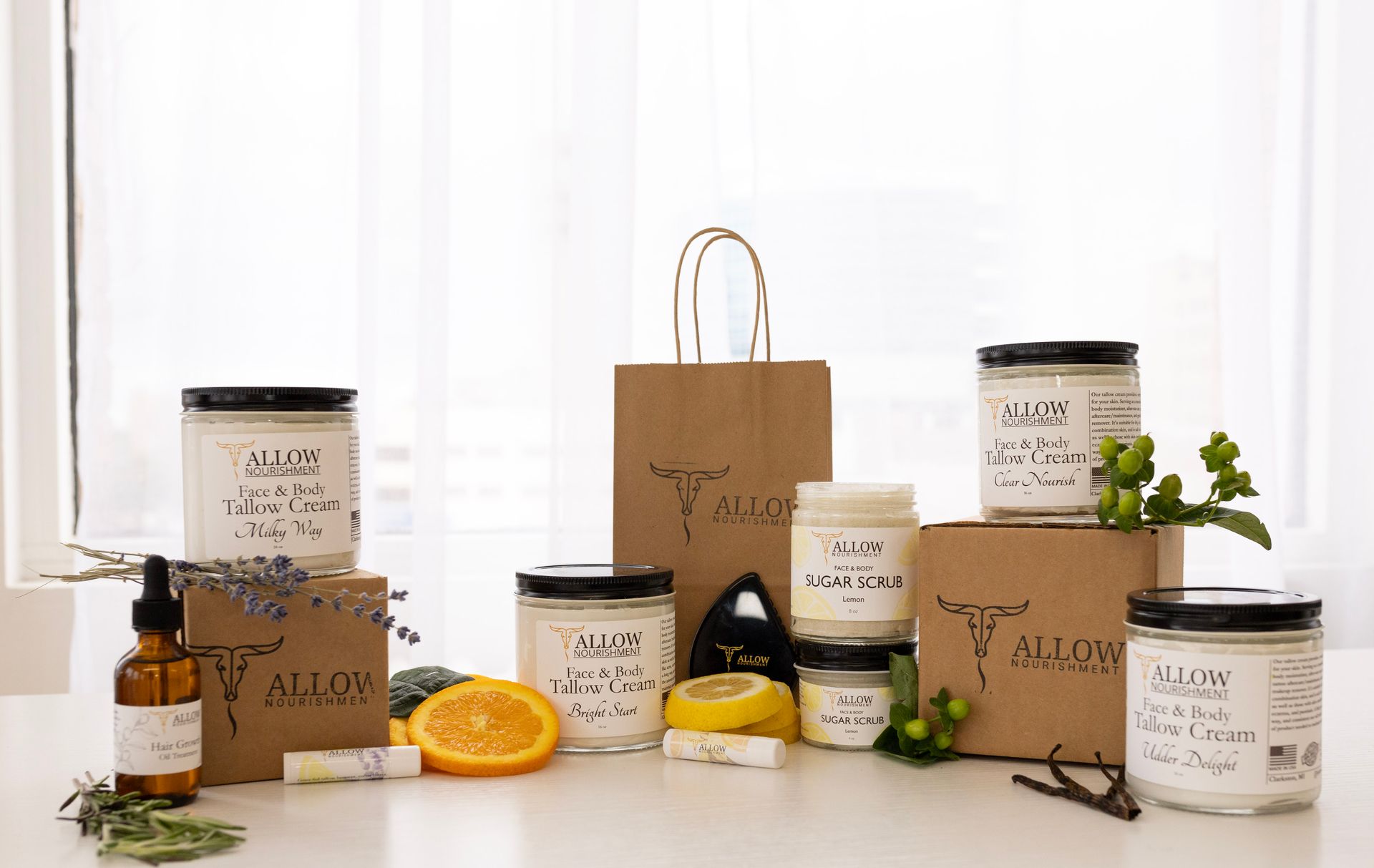 a table topped with Allow Nourishment beef tallow products.  