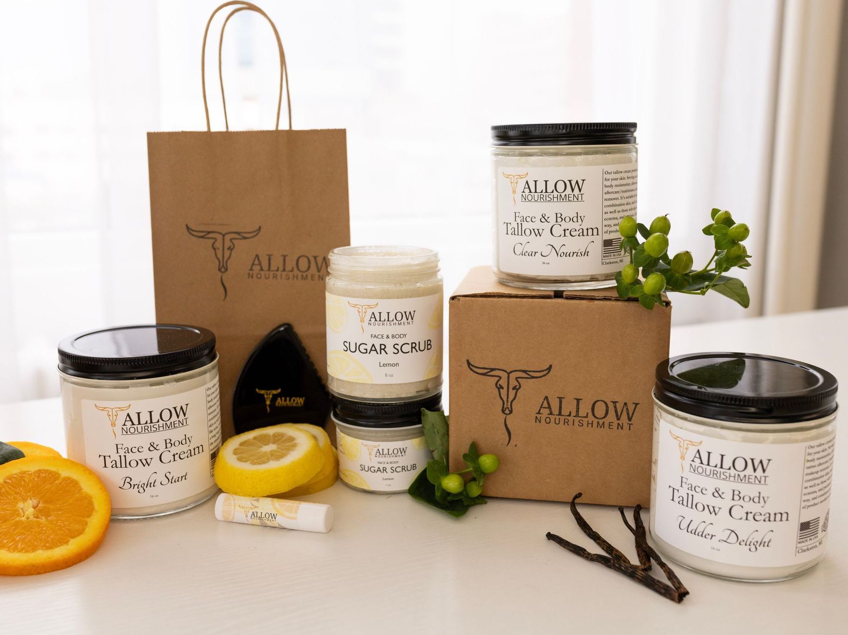 Allow Nourishment Tallow products sitting on a table.