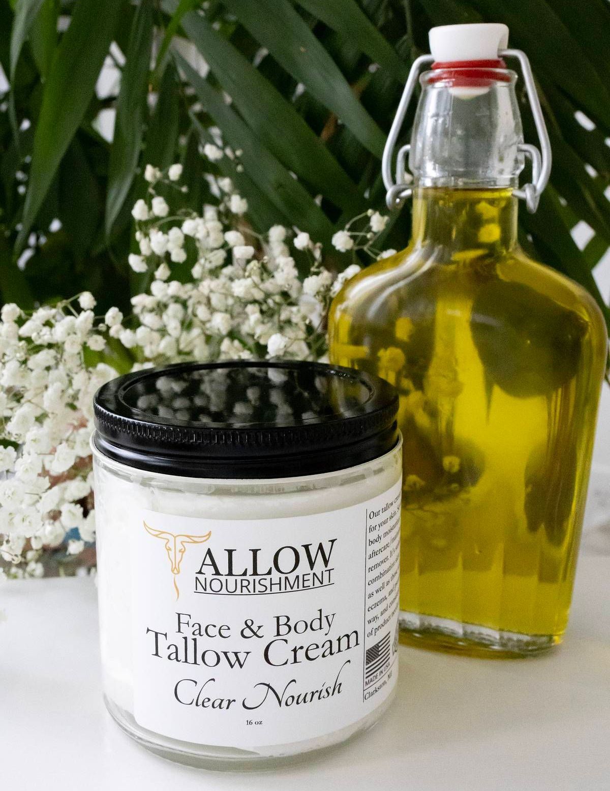 A jar of Allow Nourishment's Beef Tallow Face & Body Cream beside a jar of olive oil