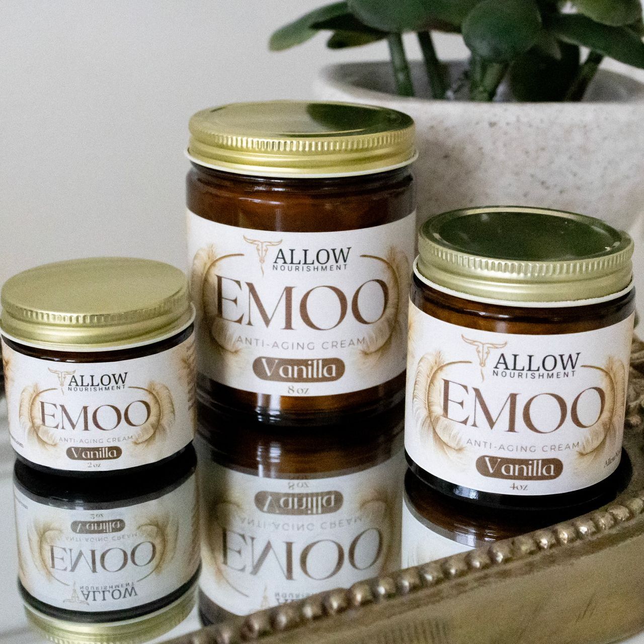 Three jars of Allow Nourishment Emoo Anti-aging Cream on a table