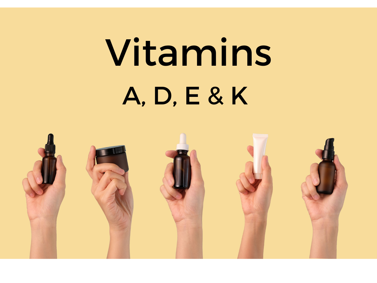 A group of hands holding bottles of vitamins a , d , e and k.