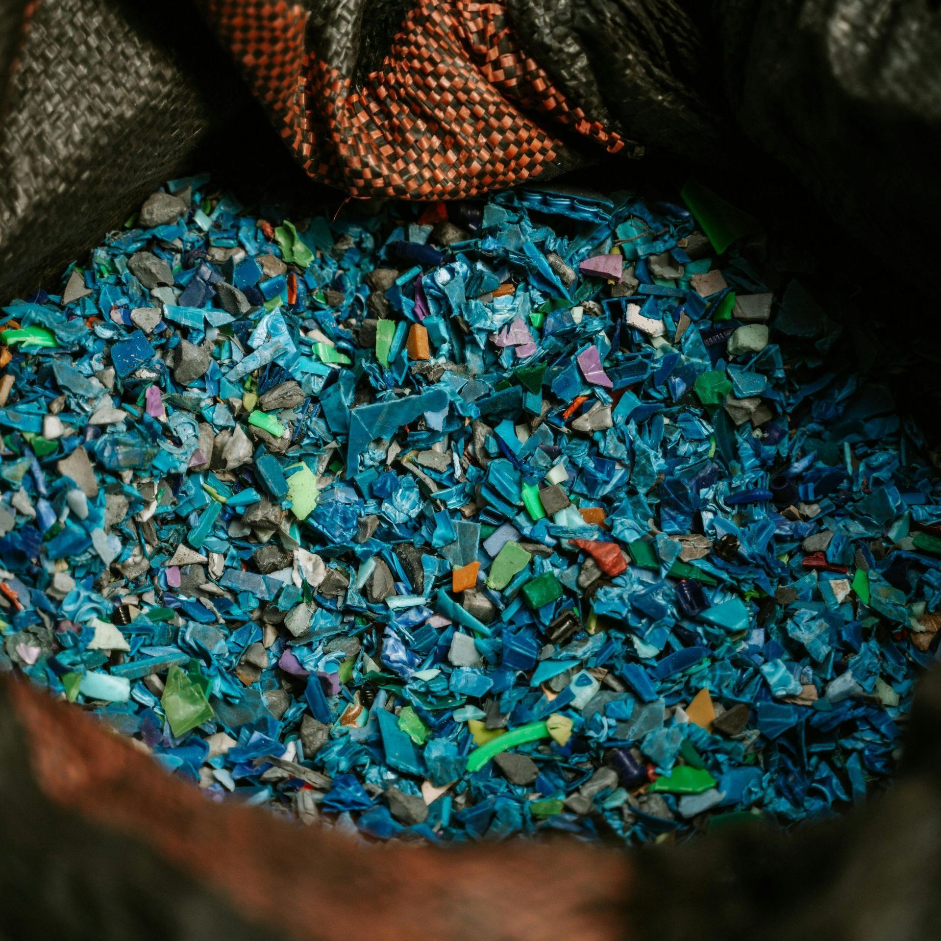 A pile of blue plastic pieces in a bag