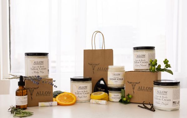 A table topped with boxes , jars , bottles and a bag.