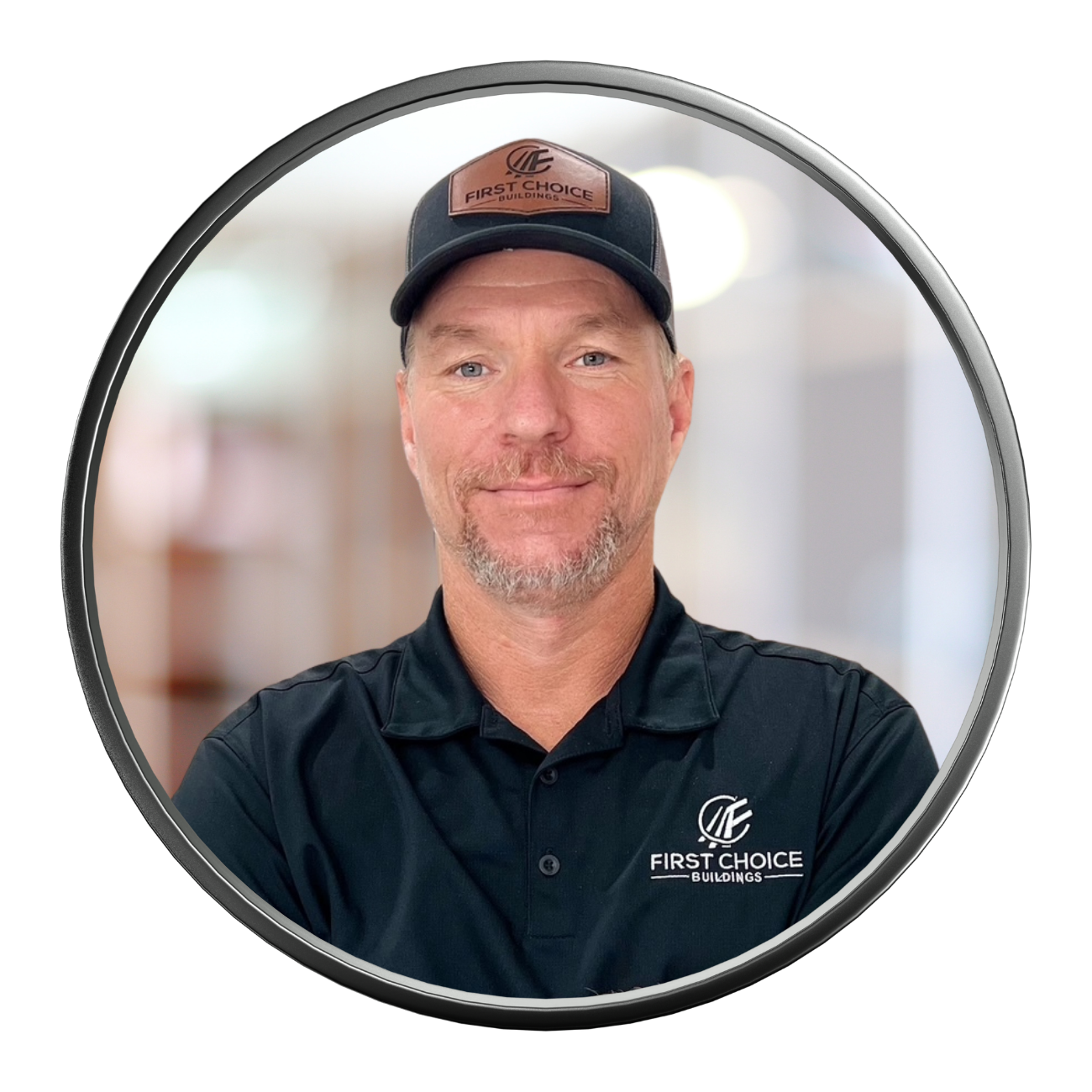Man in black polo and cap, smiling. First Choice Homes logo on cap and shirt.