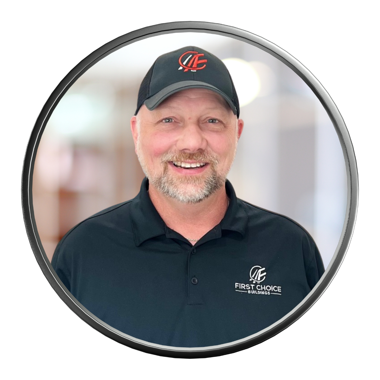 Smiling man in black polo and cap; circular headshot, blurry office background.
