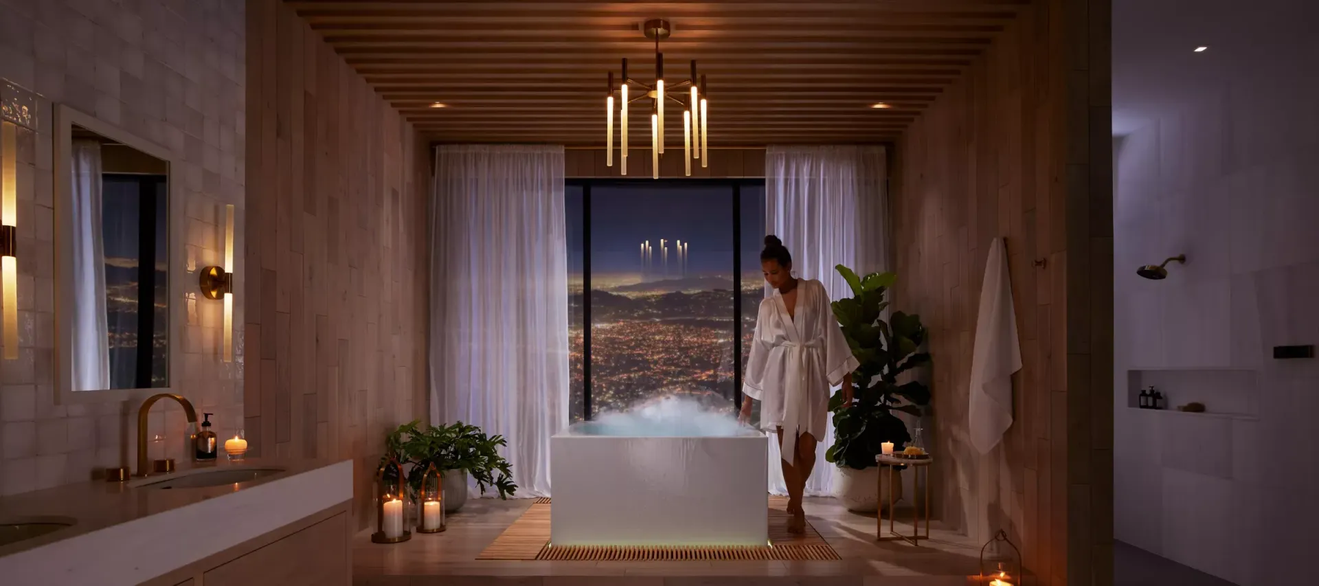 Modern bathroom with glass walls, shower, and bathtub overlooking a scenic view.