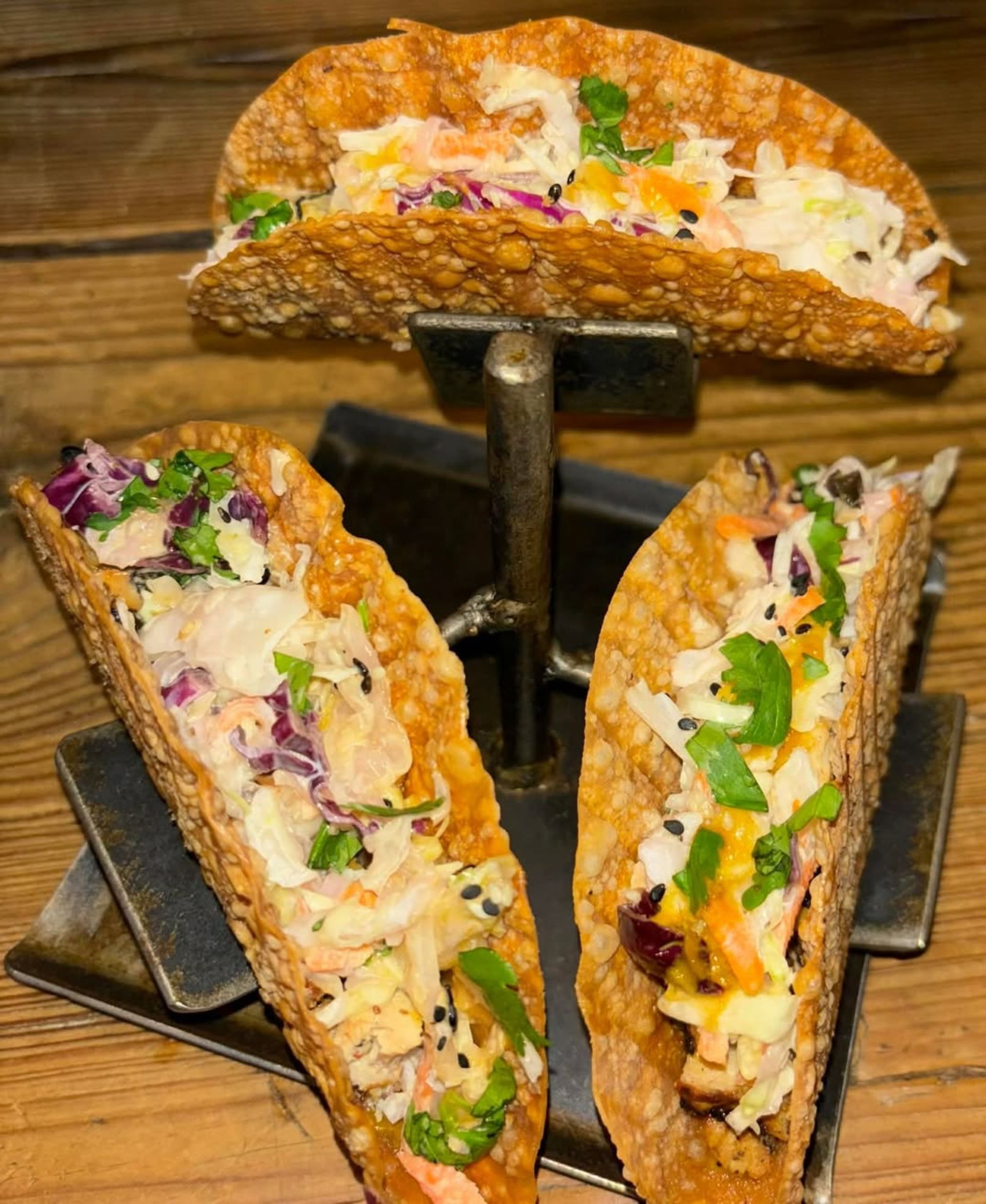 CRISPY JUICY CHICKEN, CUCUMBER, CARROTS, RED ONIONS, CELERY & RED PEPPERS SITTING ON A BED OF TOSSED ROMAINE CABBAGE MIX