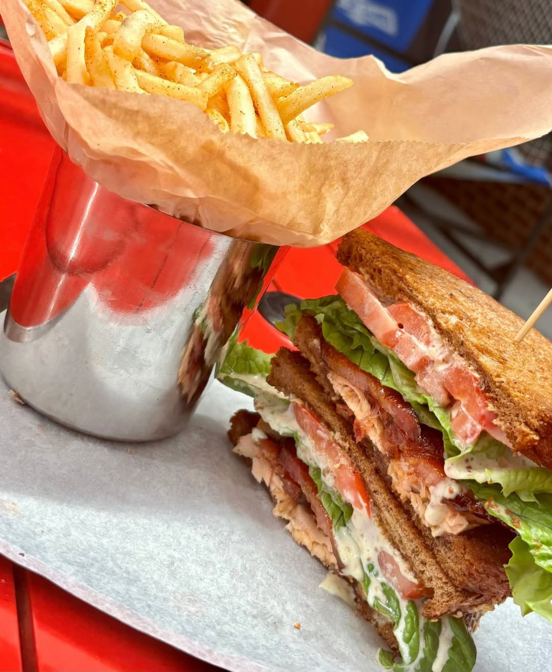 CRISPY-SHRIMP, SLICED TOMATOES , BIBB LETTUCE, GARLIC AIOLI ON SIGNATURE ROLL CHOICE OF FRIES OR SIDE SALAD