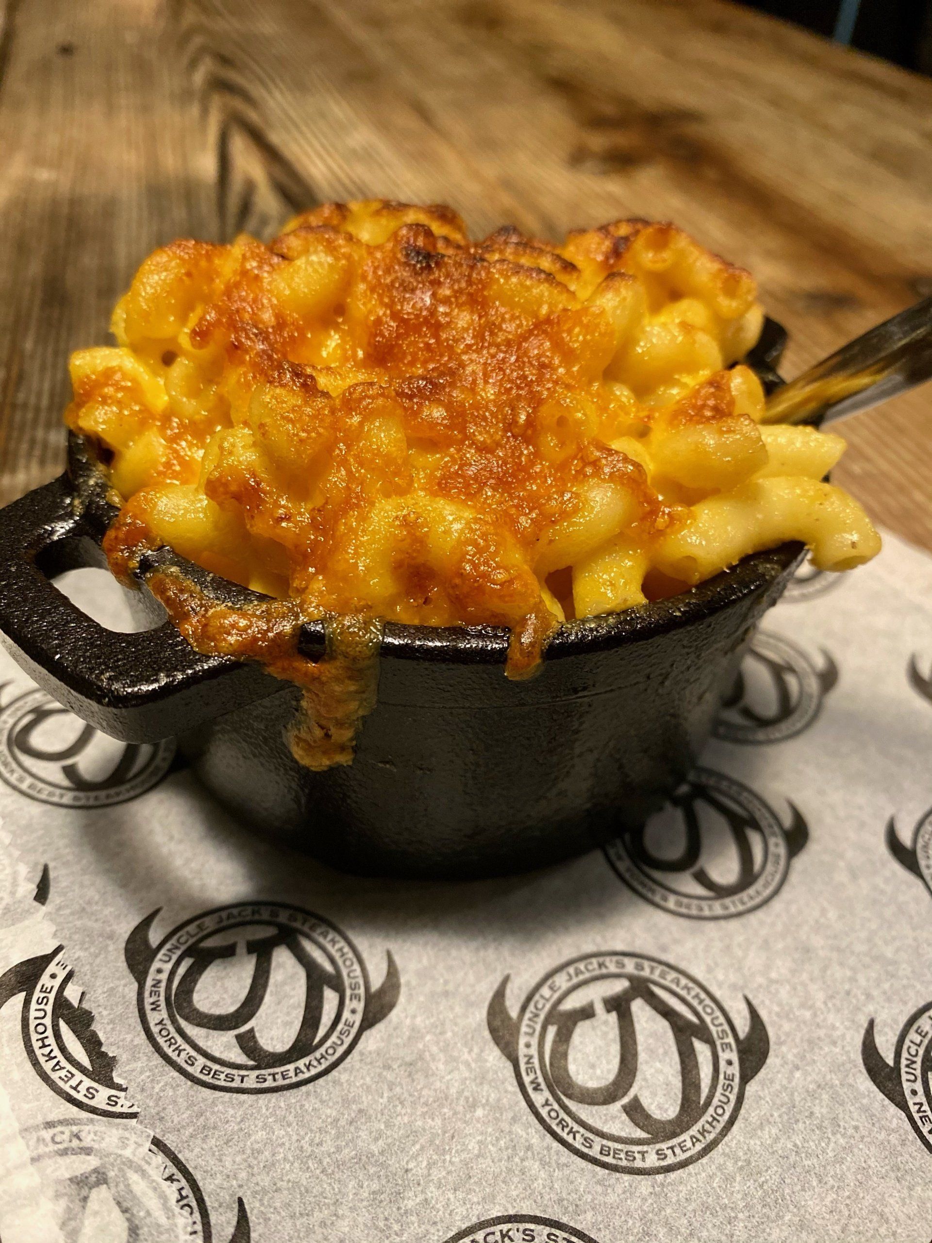 a bowl of macaroni and cheese sits on a paper that says jack 's best steakhouse