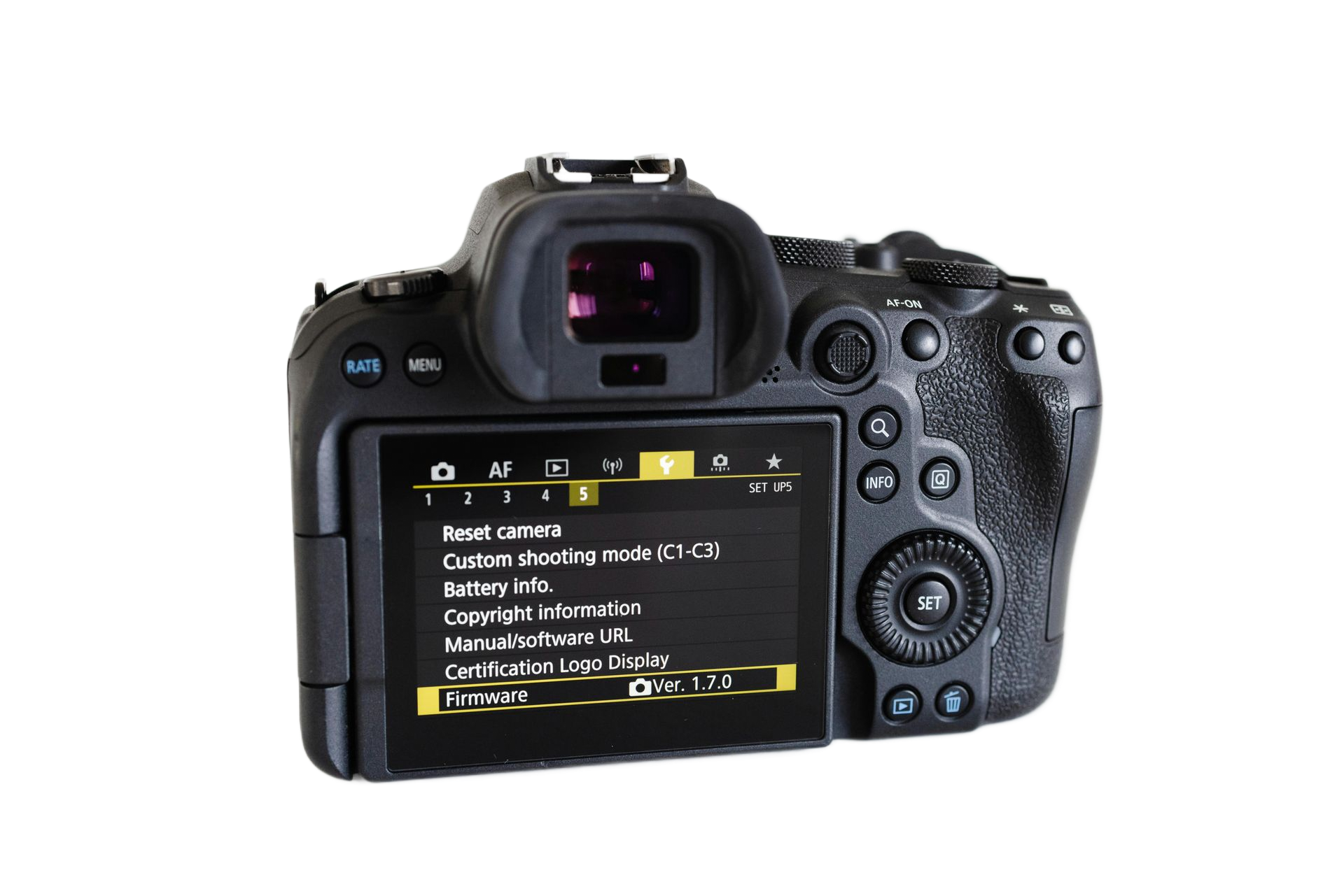 Black digital camera showing menu on LCD screen.