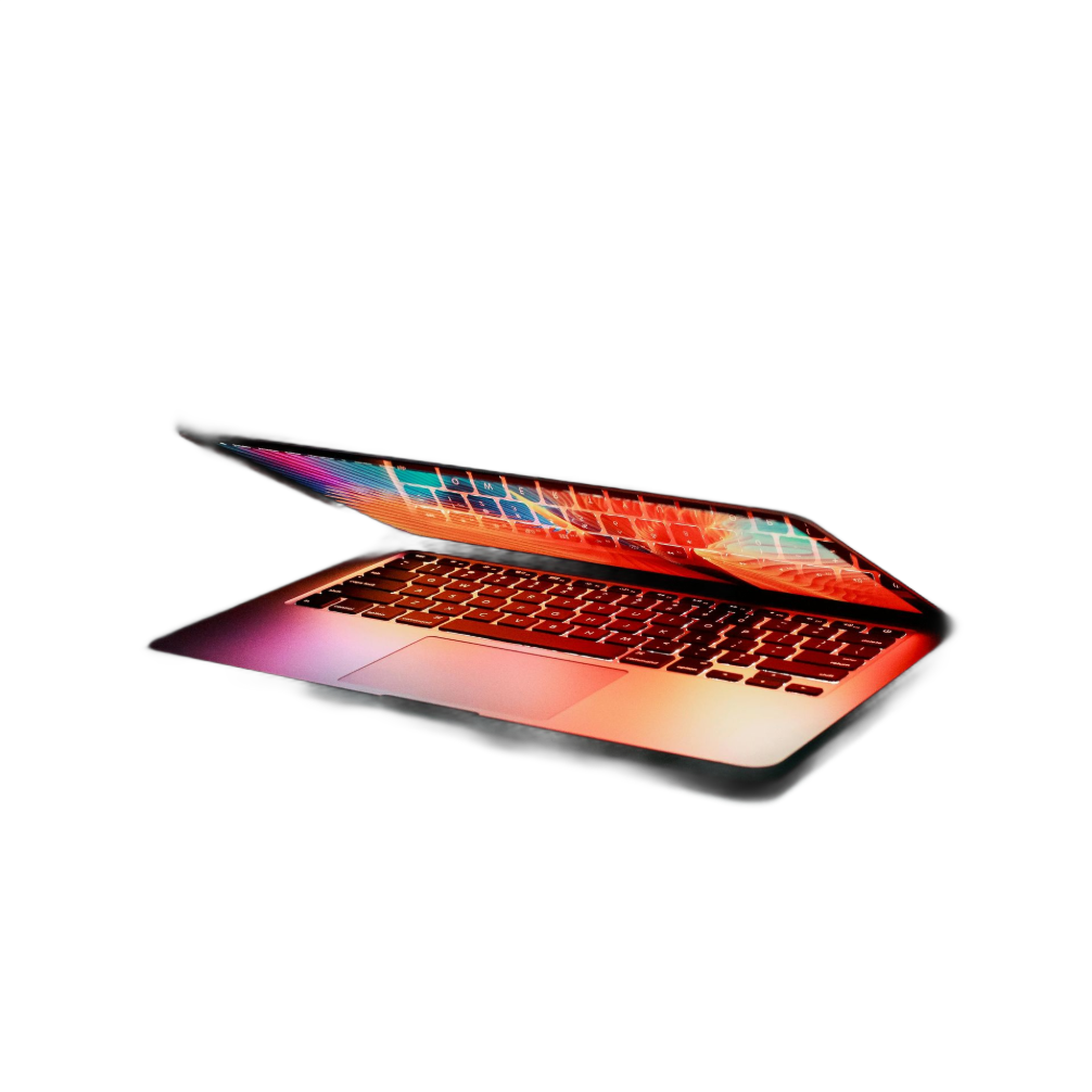 Laptop with colorful screen glowing in a dark setting.