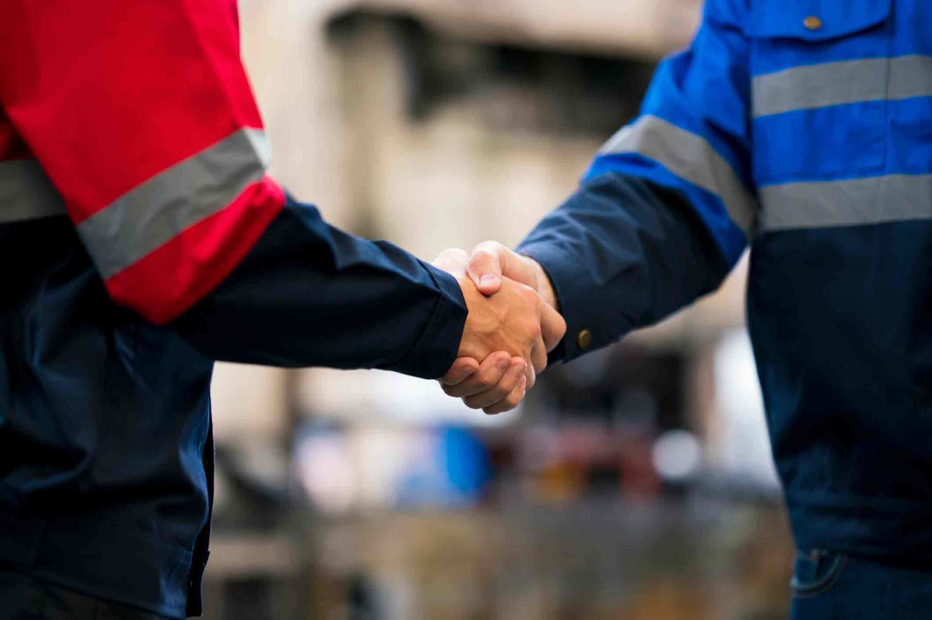 Industrial Workers Shaking Hands — Milwaukee, WI — One Source Staffing, Inc.