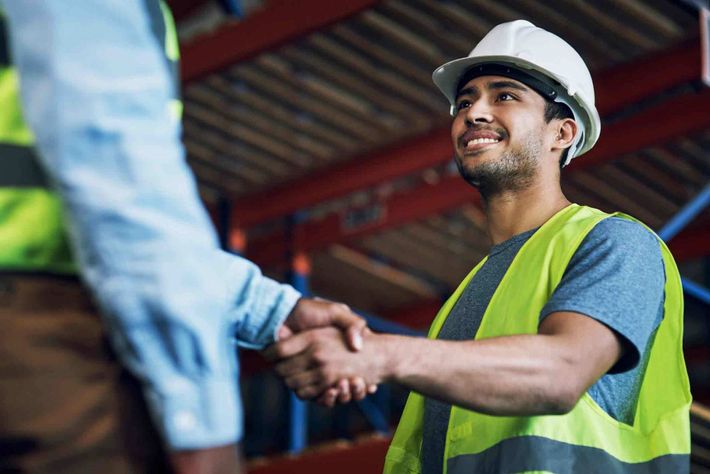 Smiling Worker Getting A Hand Shake — Milwaukee, WI — One Source Staffing, Inc.
