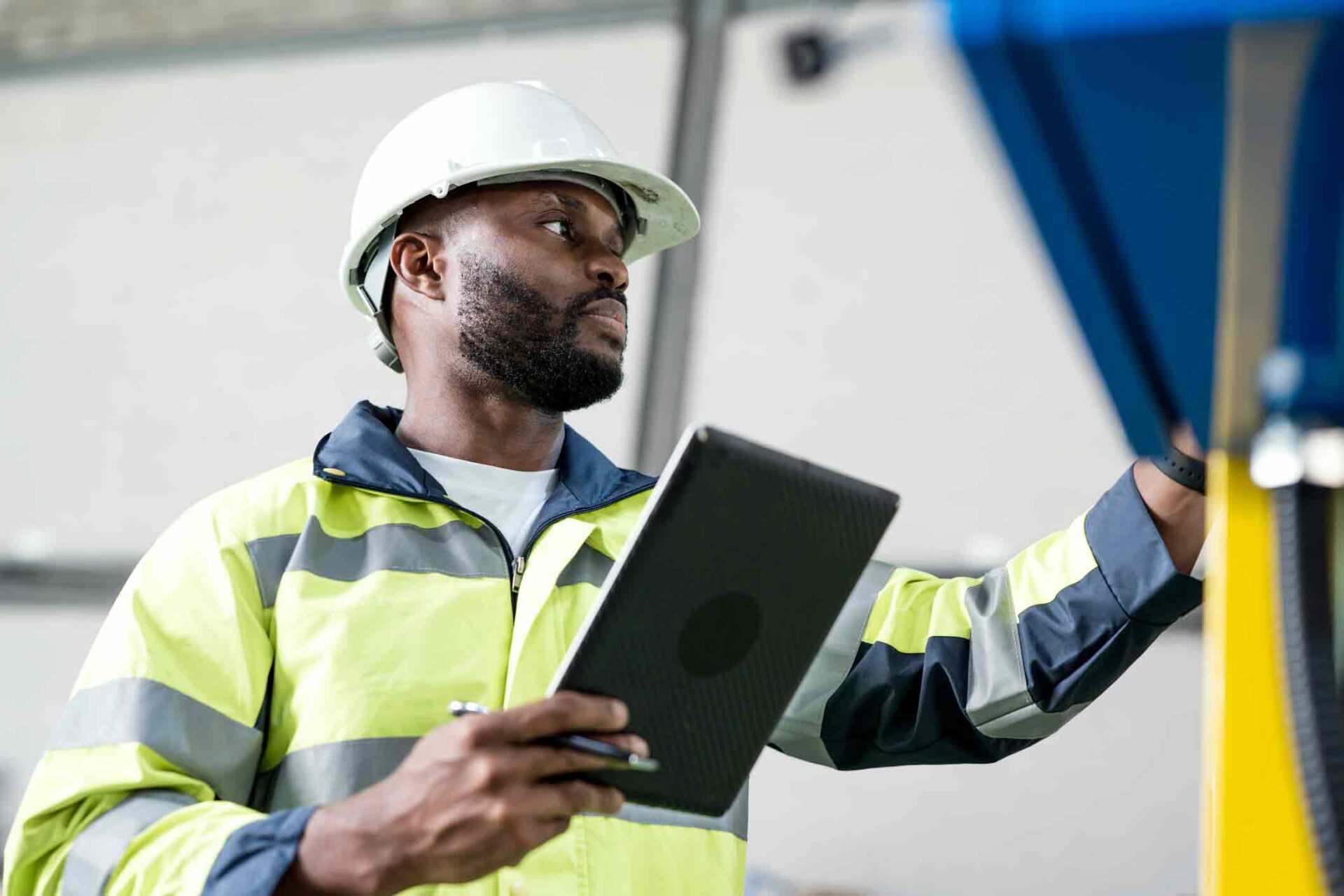 Worker Holding A Tablet — Milwaukee, WI — One Source Staffing, Inc.