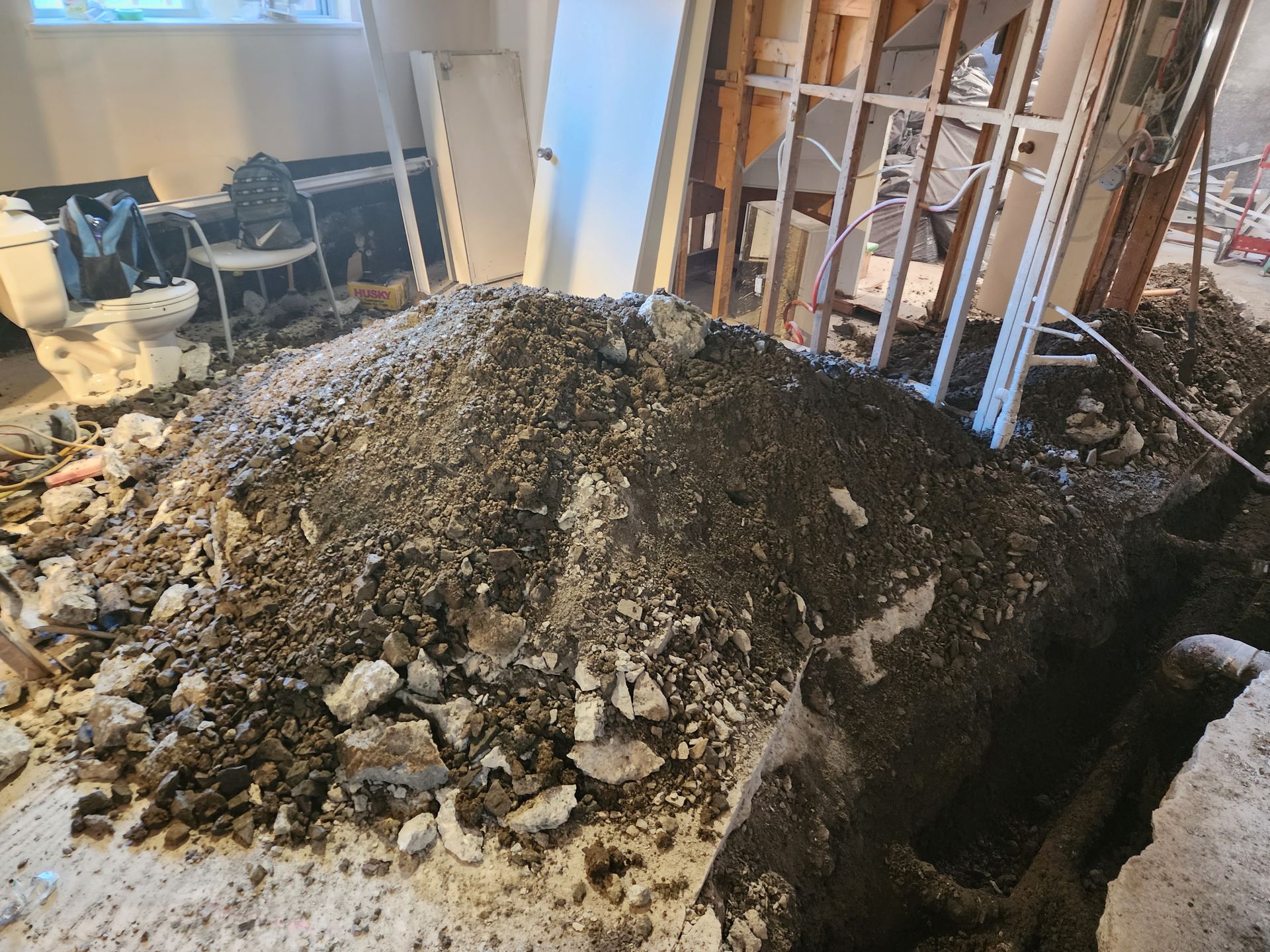 There is a pile of dirt in the middle of a room.