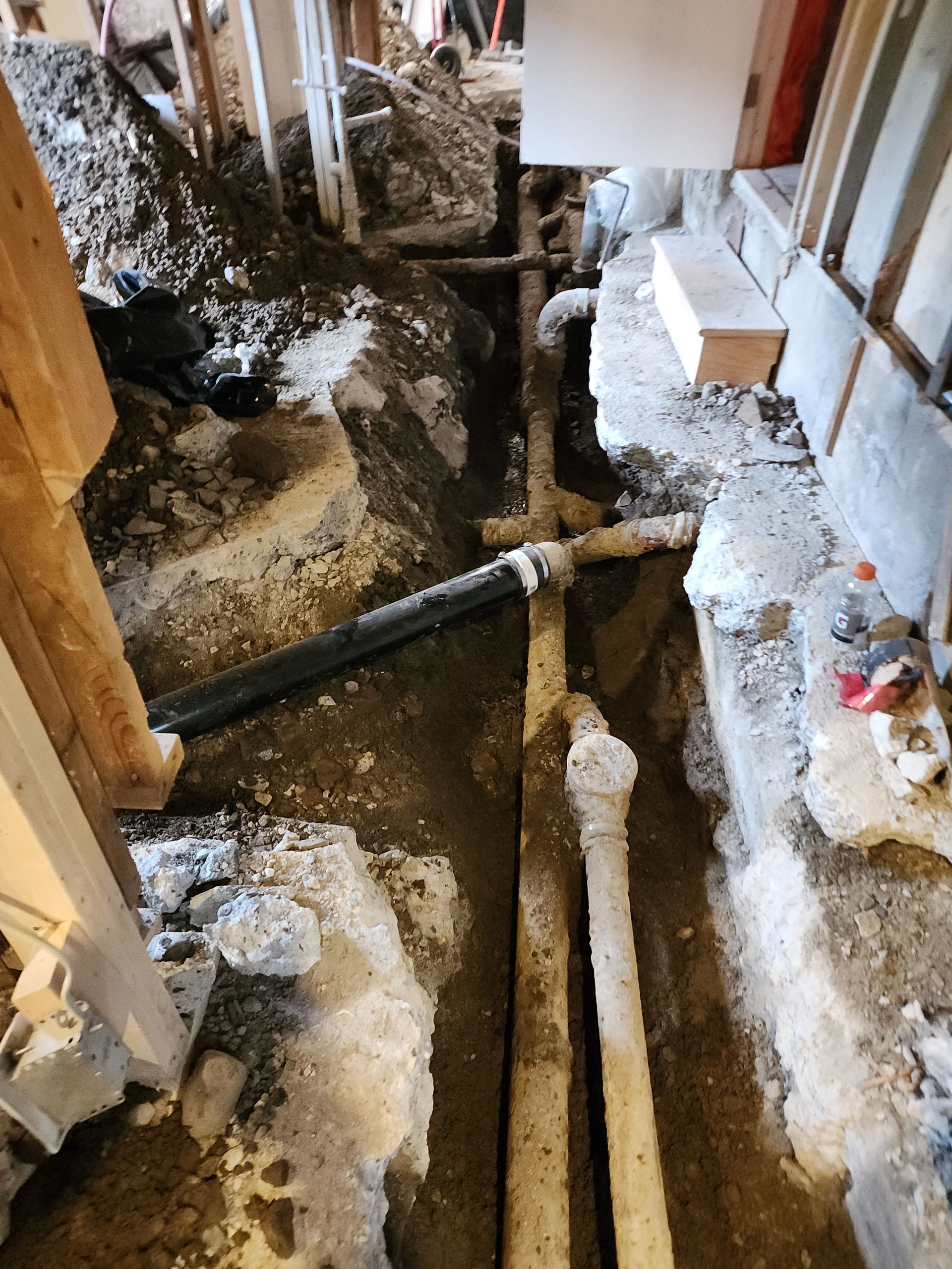 A dirty room with a lot of pipes in it