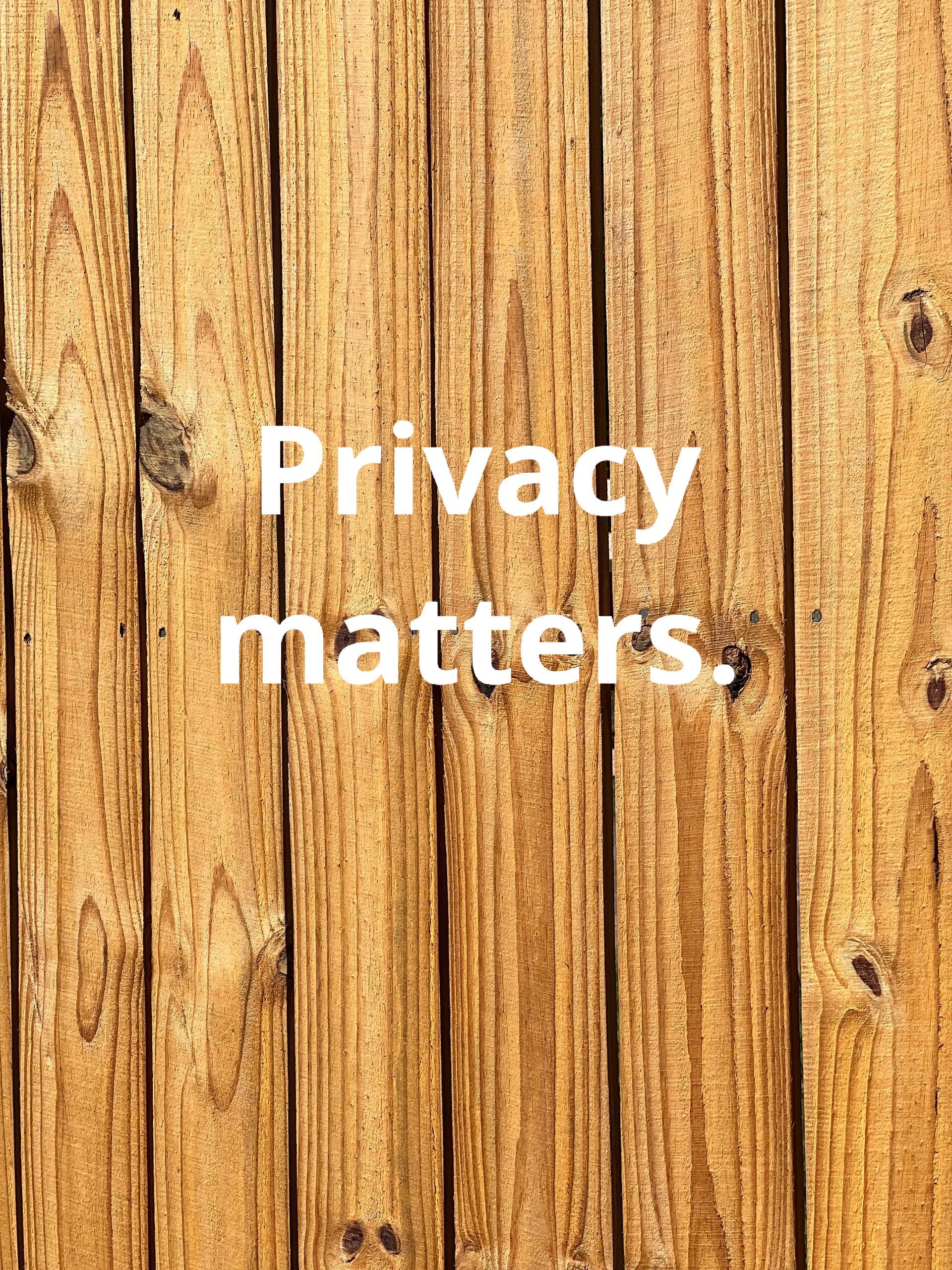 Wooden background with white text: Privacy matters.