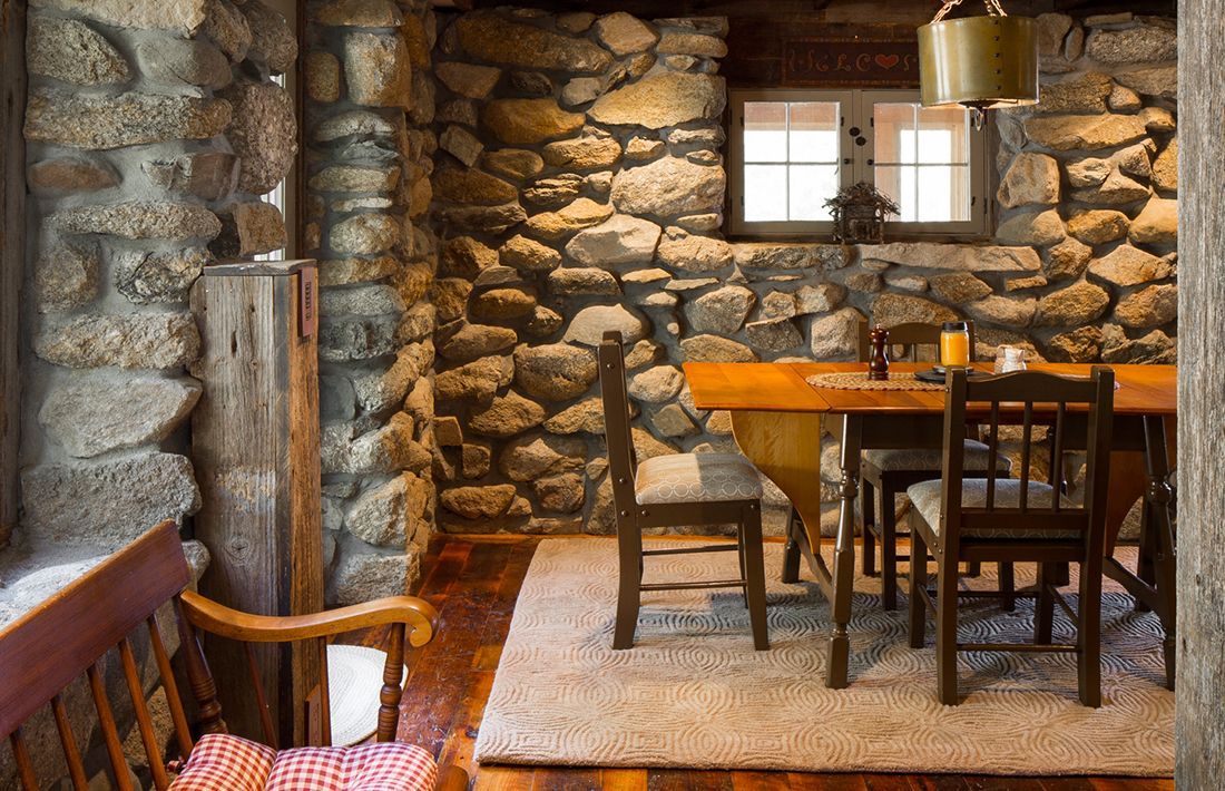 A different angle of clean dining table with chairs.