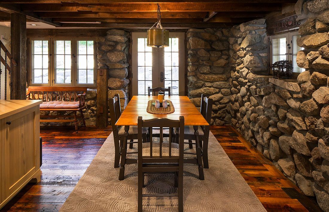 A clean dining table with chairs.