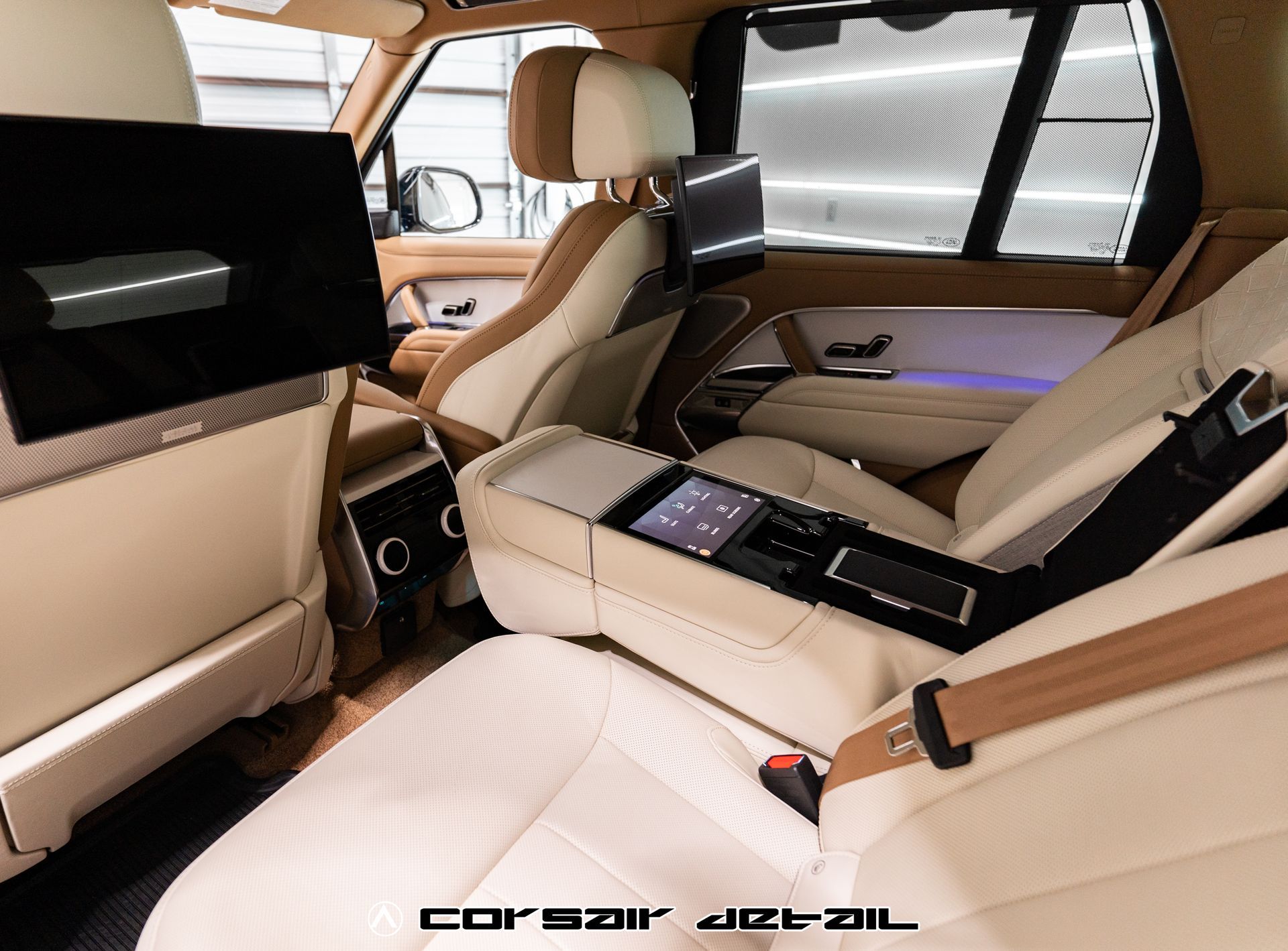 The back seat of a car with a corsair jet oil logo on it