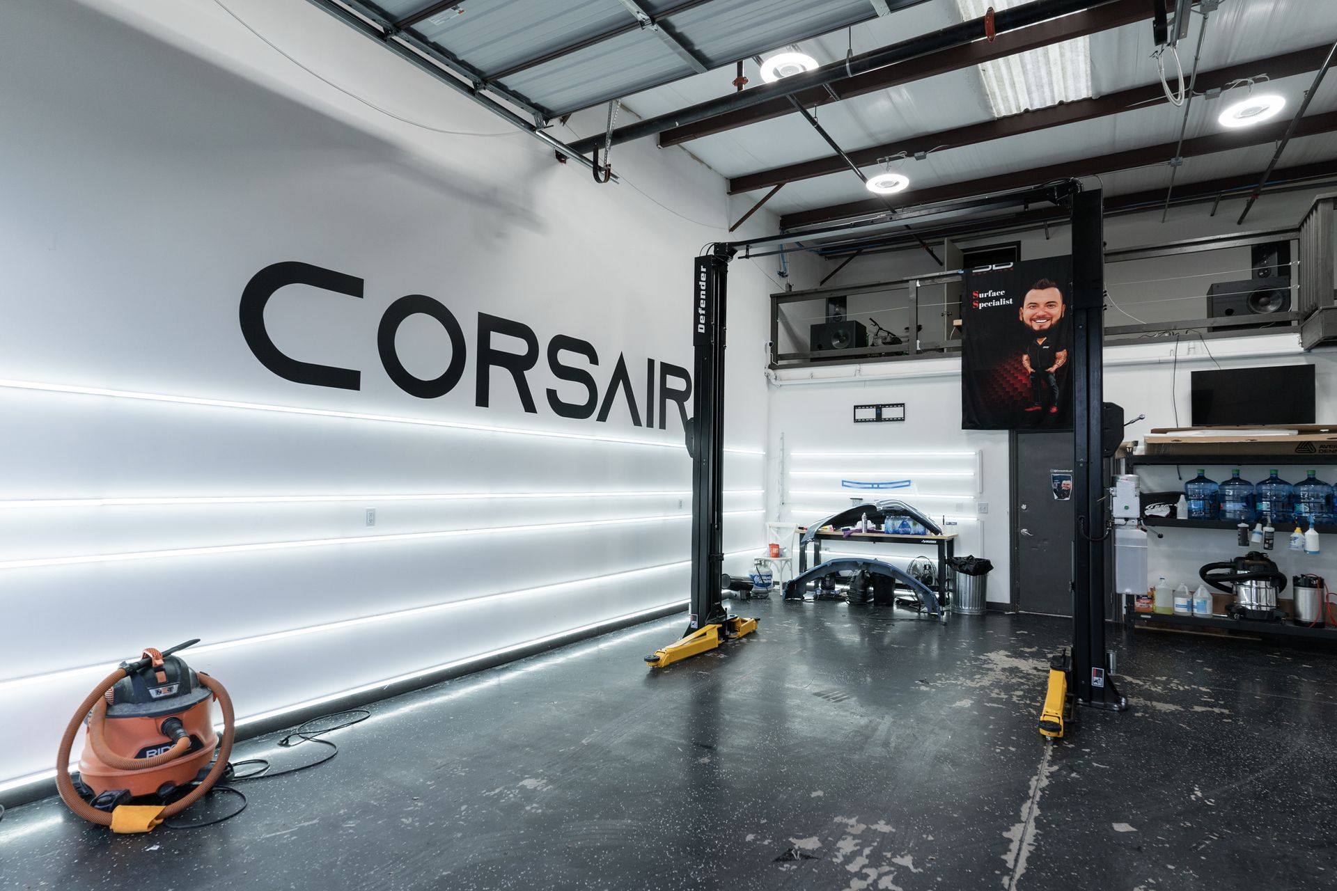 A garage with the word corsair painted on the wall
