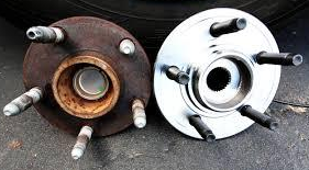 Two wheel hubs are sitting next to each other on the ground. | A2Z AutosLLC
