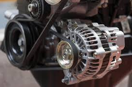 A close up of an alternator on a car engine. | A2Z AutosLLC
