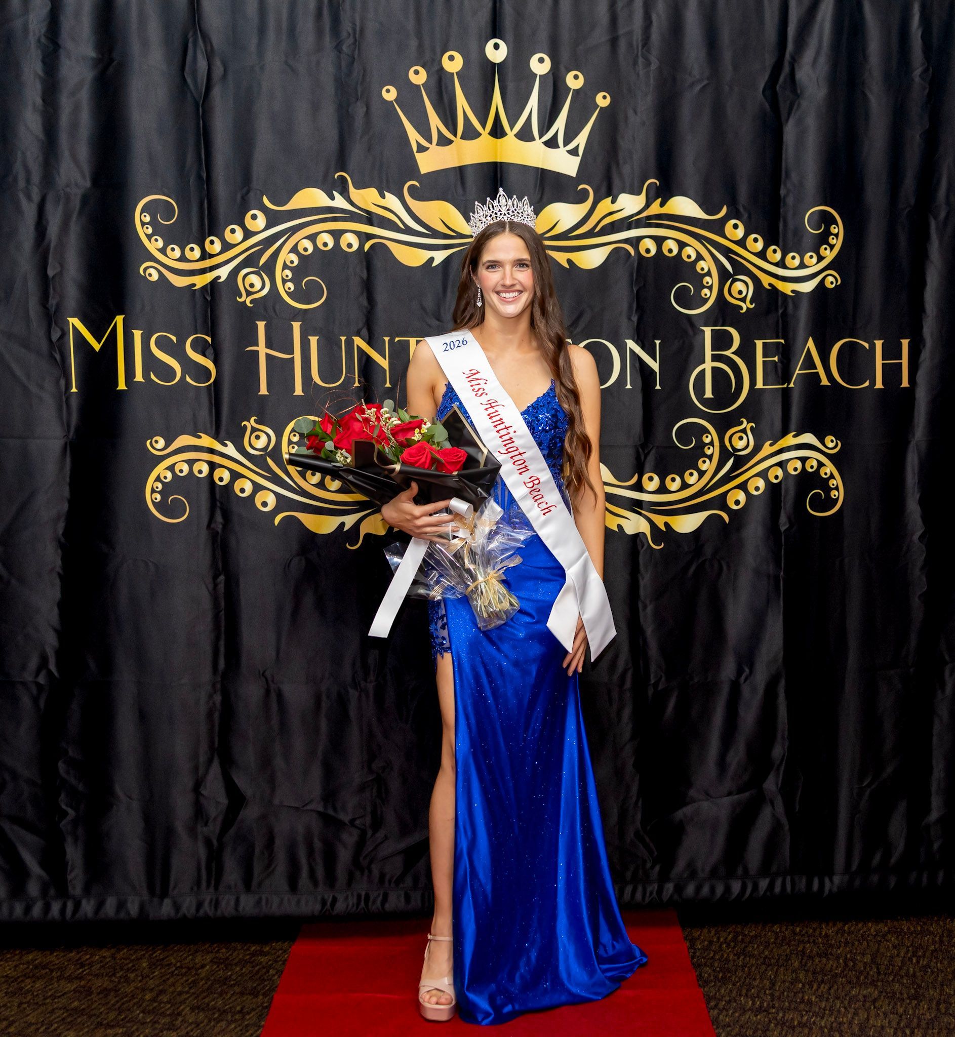 Miss Huntington Beach winner in a blue gown, holding flowers. She wears a tiara and sash., Gabrielle Samiy