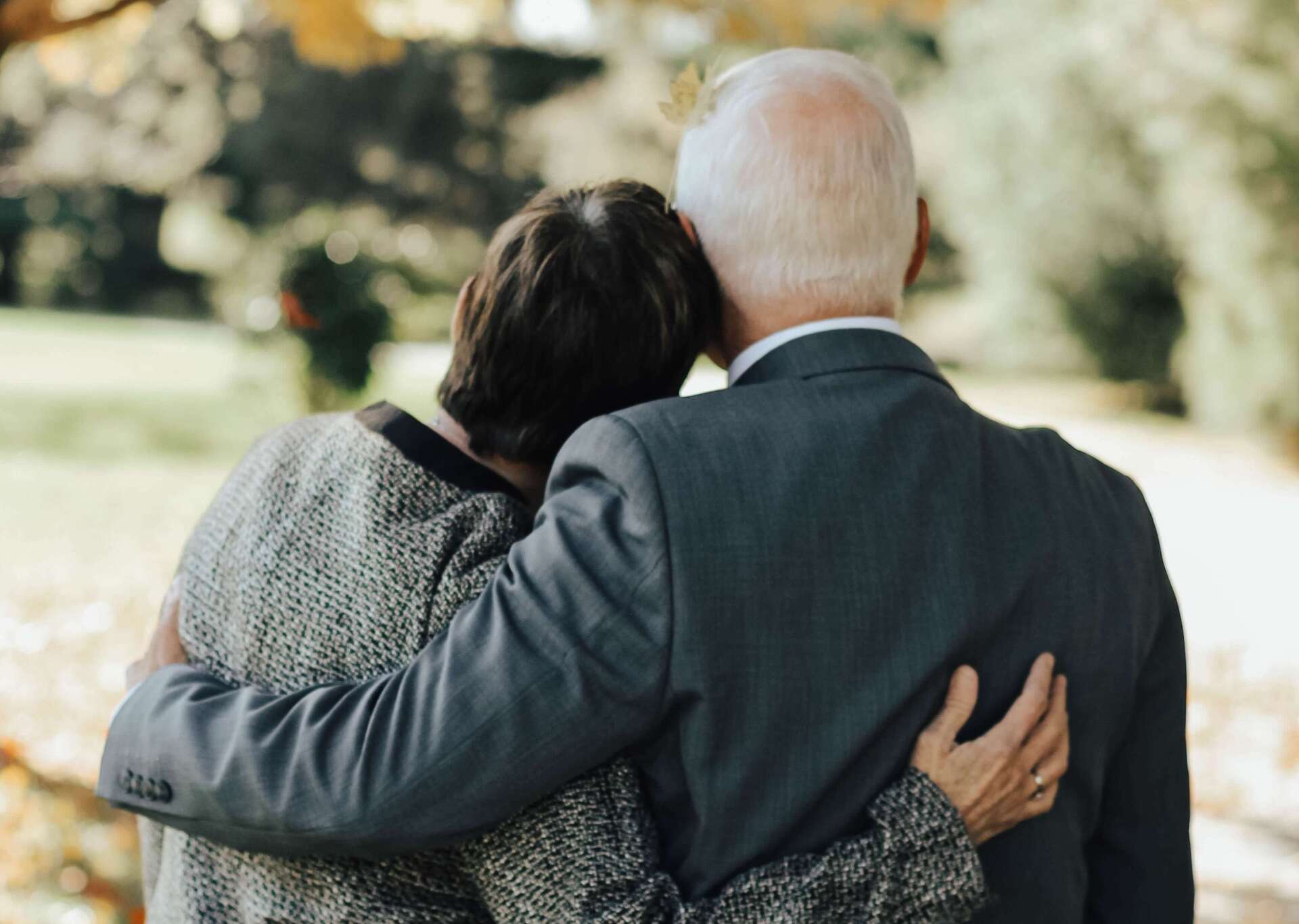 what to do at a funeral man woman hugging