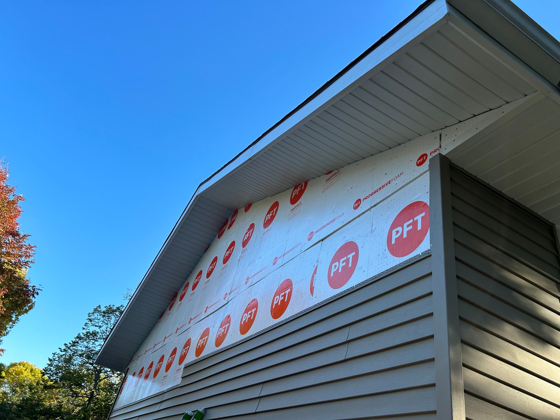 A house with a roof that has a pft sign on it