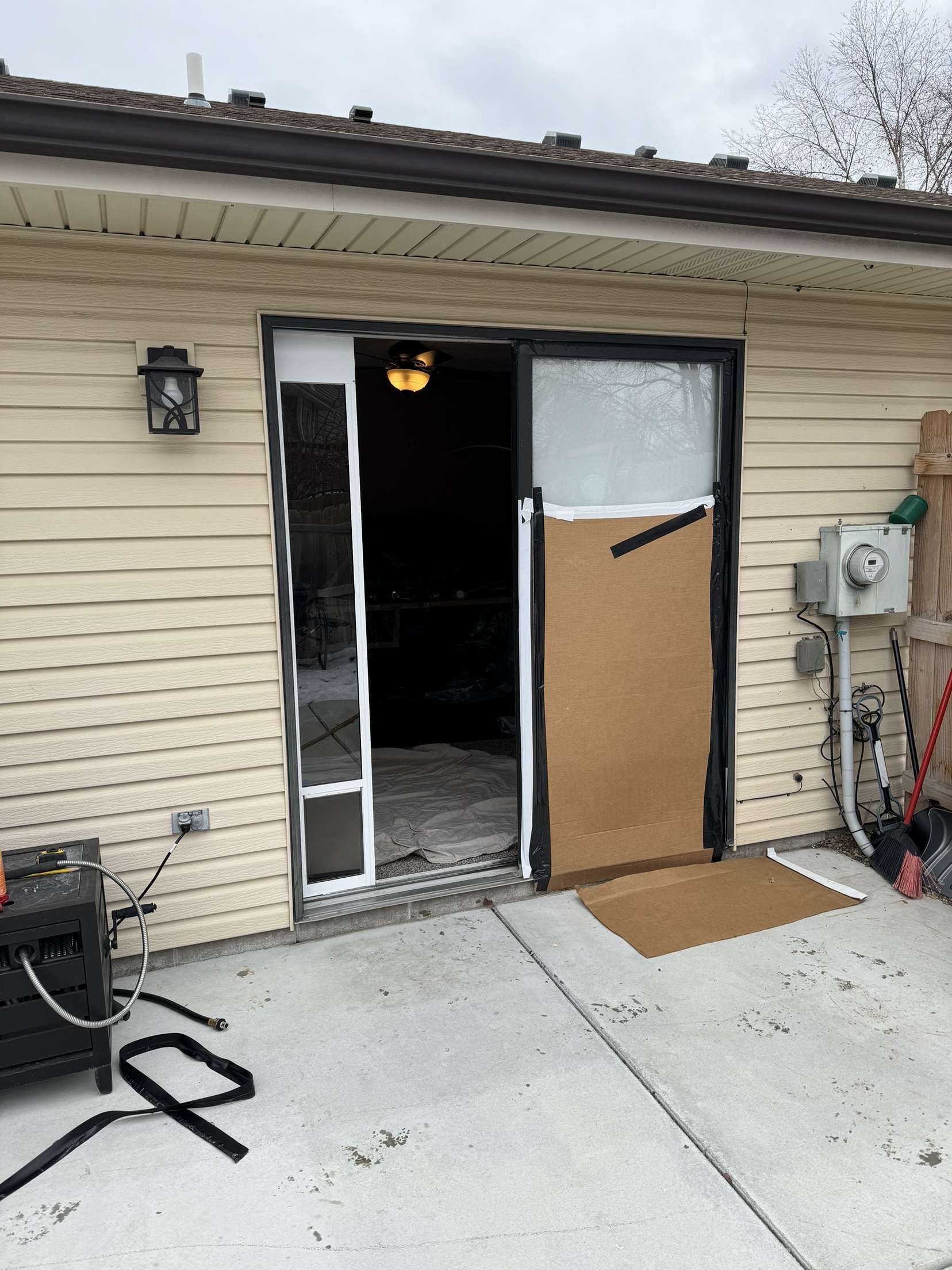A house with a sliding glass door is being remodeled