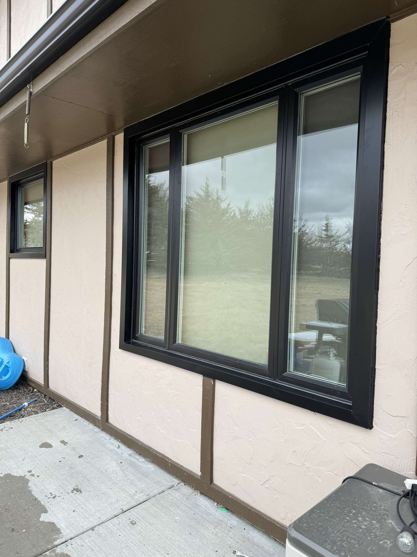 A house with a lot of windows on the side of it.