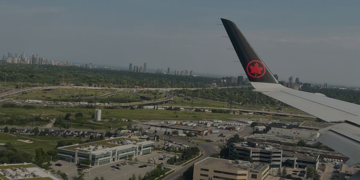 Air Canada airplane wing flying over Toronto