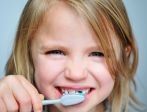 girl brushing teeth