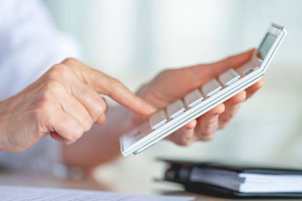 A person working with a calculator | Local Tax Accountant Hobart, TAS