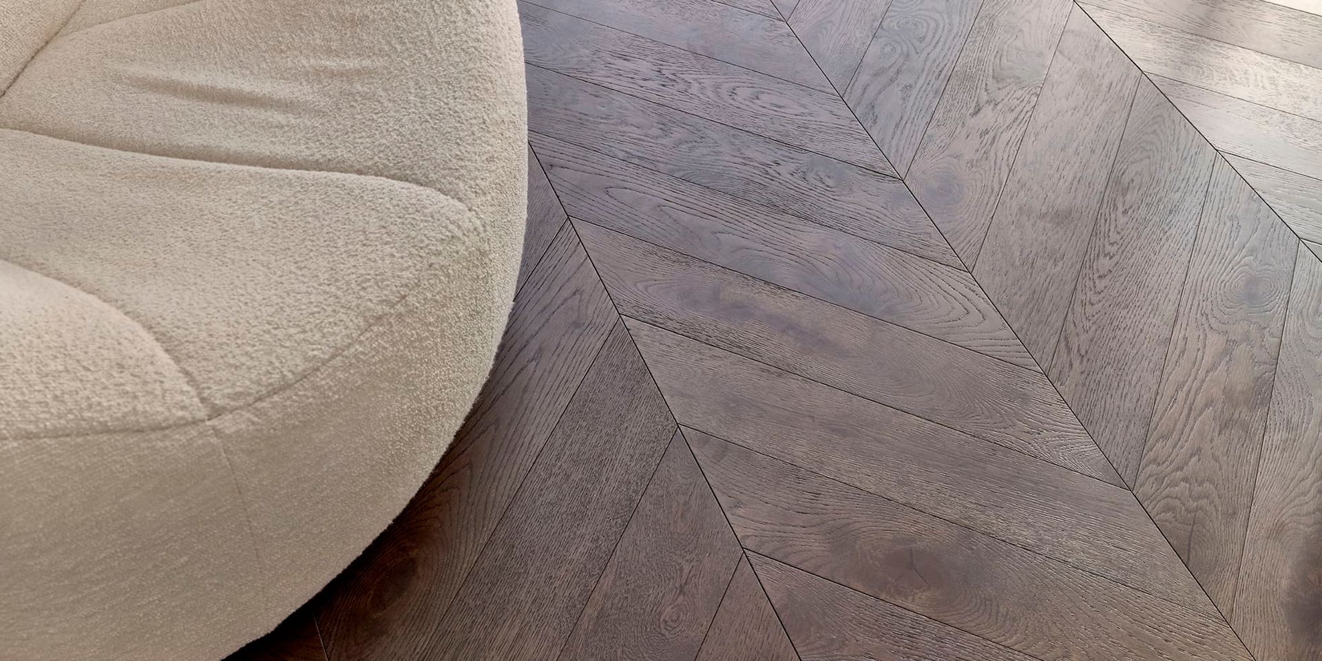 A Bedroom with A Bed, Chair, Nightstand and Rug — Kelwin Coastal Carpets In North Brisbane, QLD