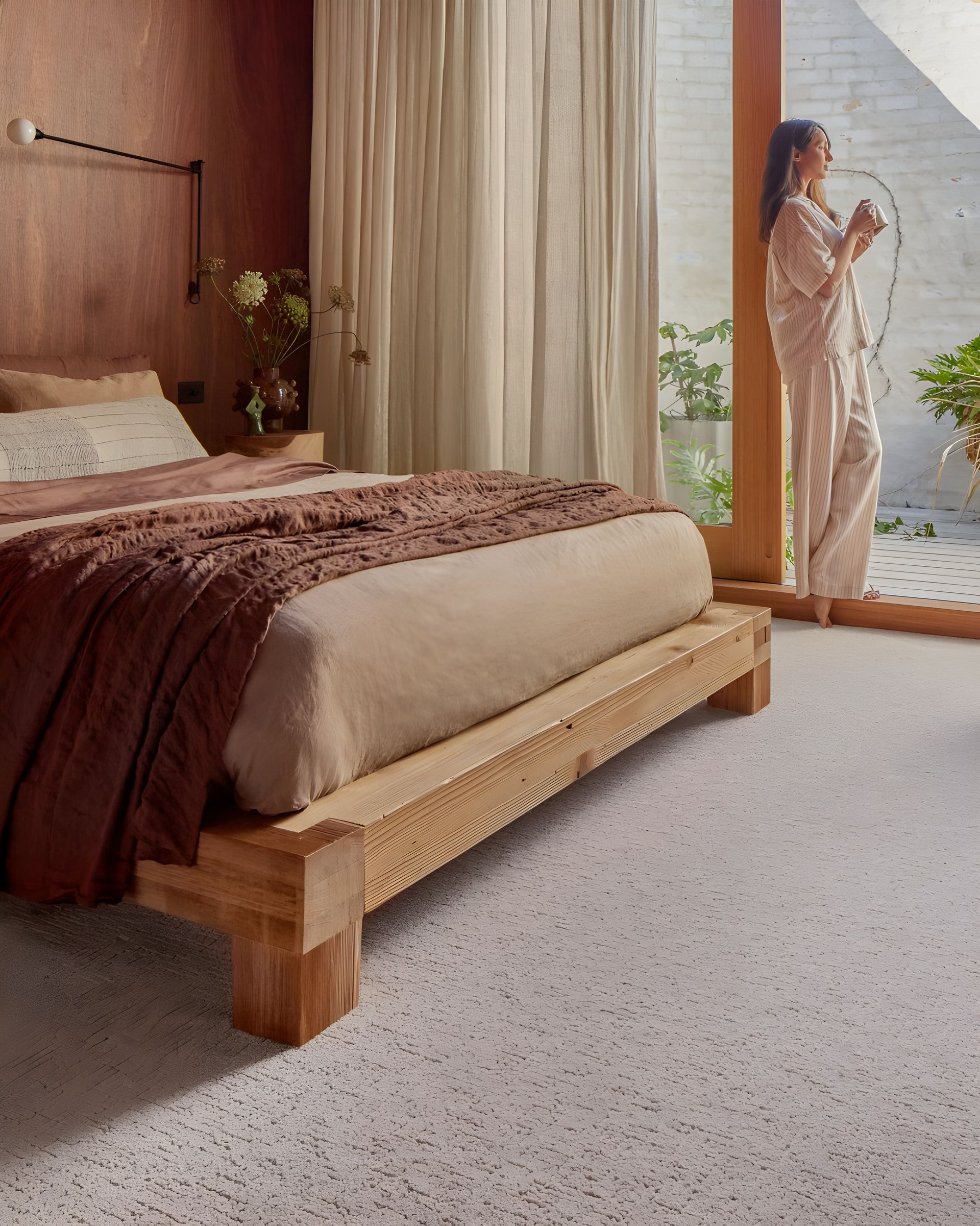 A Living Room with A Couch, Coffee Table, and Fireworks on The Wall — Kelwin Coastal Carpets In North Brisbane, QLD