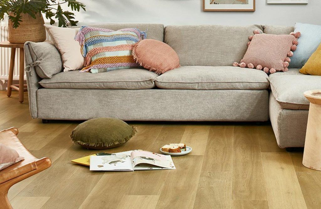 A Living Room with A Couch and Pillows on The Floor — Kelwin Coastal Carpets In Gympie, QLD