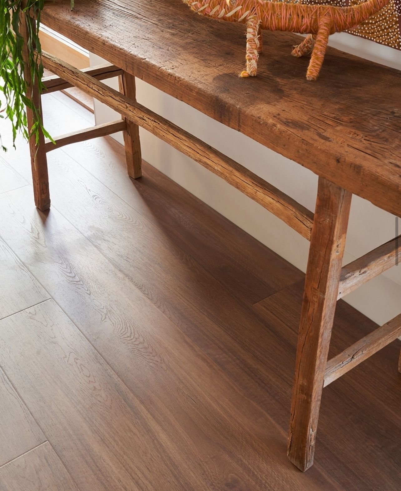 A Living Room with A Couch, Coffee Table, and Fireworks on The Wall — Kelwin Coastal Carpets In Kundra Park, QLD