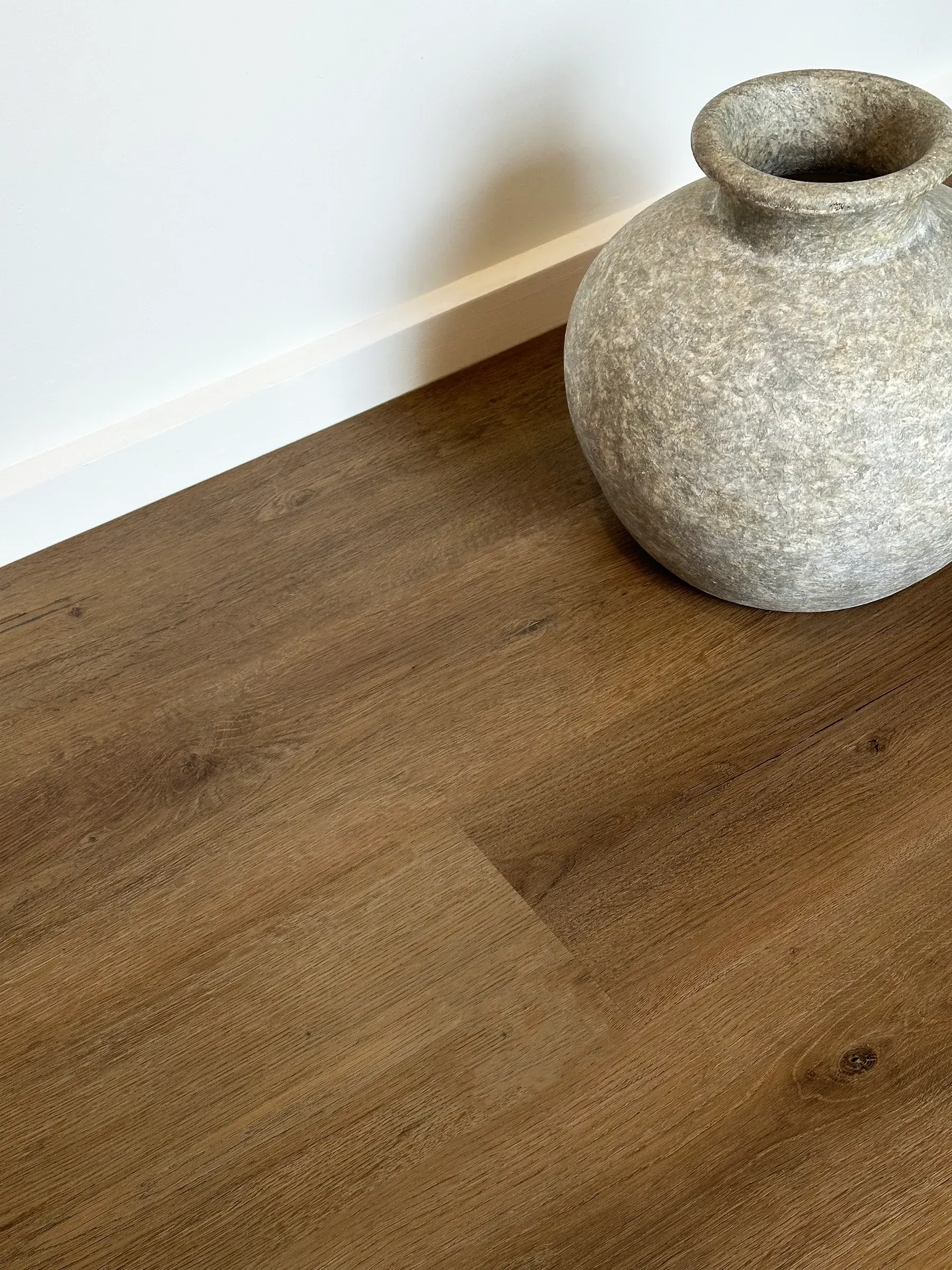 A Living Room with A Couch, Coffee Table, and Fireworks on The Wall — Kelwin Coastal Carpets In Kundra Park, QLD