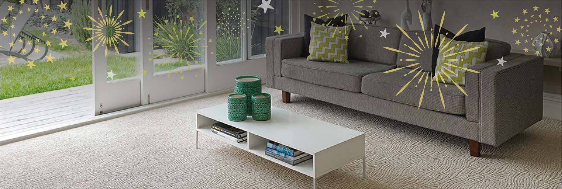 A Living Room with A Couch, Coffee Table and Fireworks on The Wall — Kelwin Coastal Carpets In Gympie, QLD