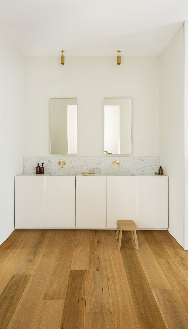 A Living Room with A Couch, Coffee Table, and Fireworks on The Wall — Kelwin Coastal Carpets In Kundra Park, QLD