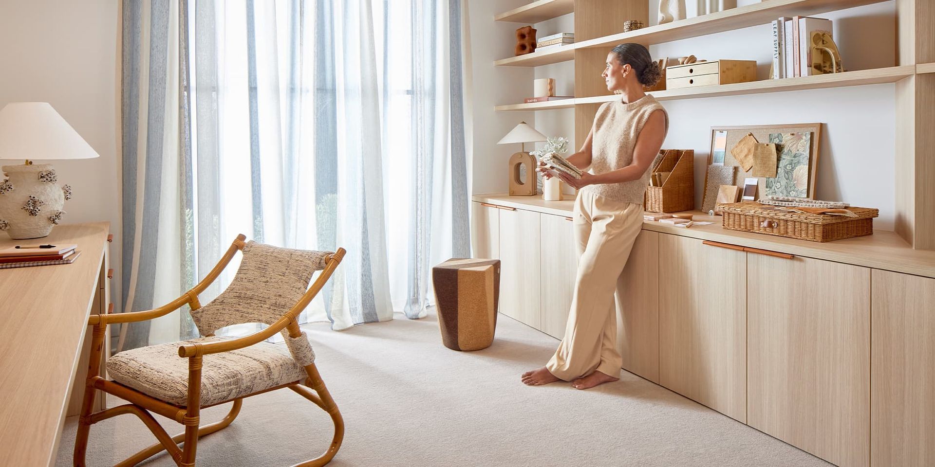 A Living Room with A Couch, Coffee Table and Fireworks on The Wall — Kelwin Coastal Carpets In Sunshine Coast, QLD
